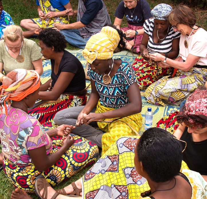 Students working with Rwandan women