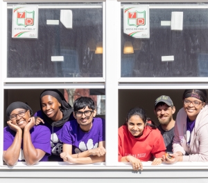 Photo of 6 volunteers in a newly-installed window.