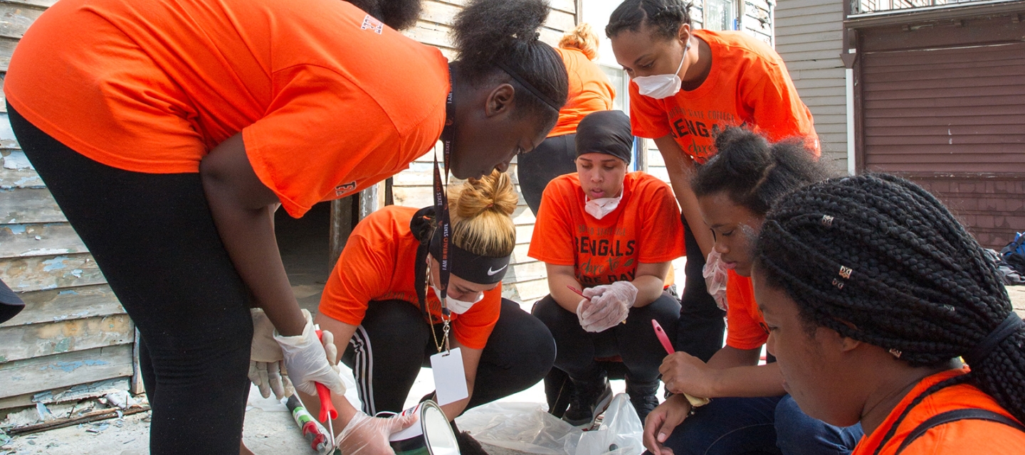 Dare to Care volunteers painting